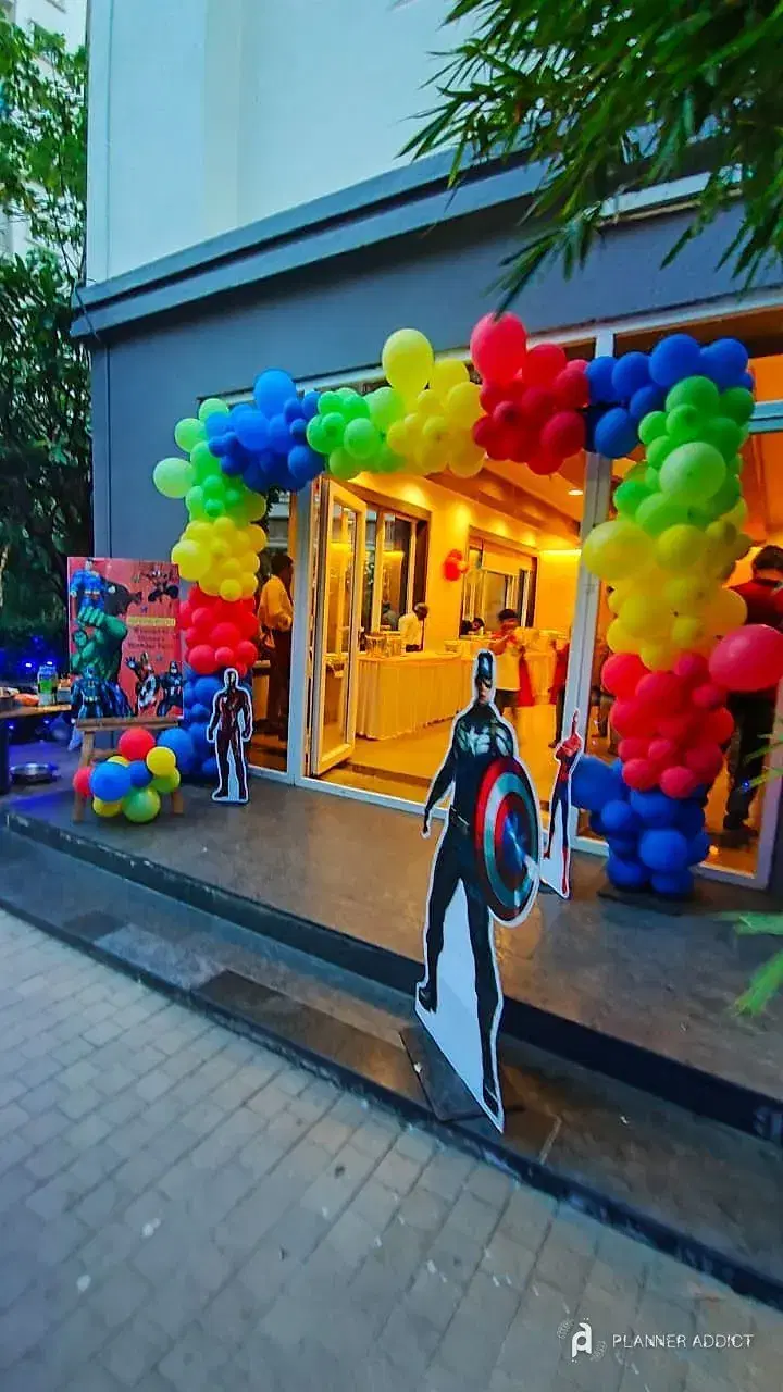 Rainbow balloon arch at a venue entrance