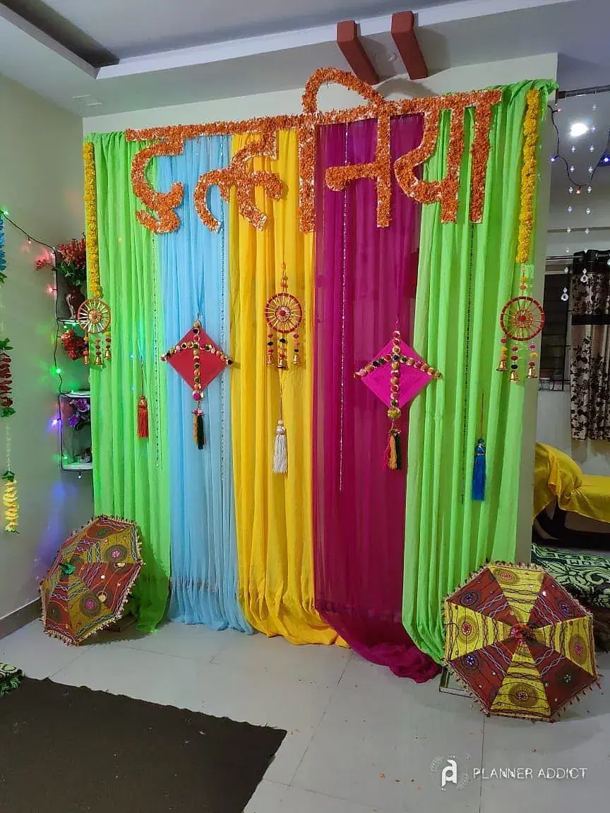 Bright drape backdrop with hanging kites and umbrellas