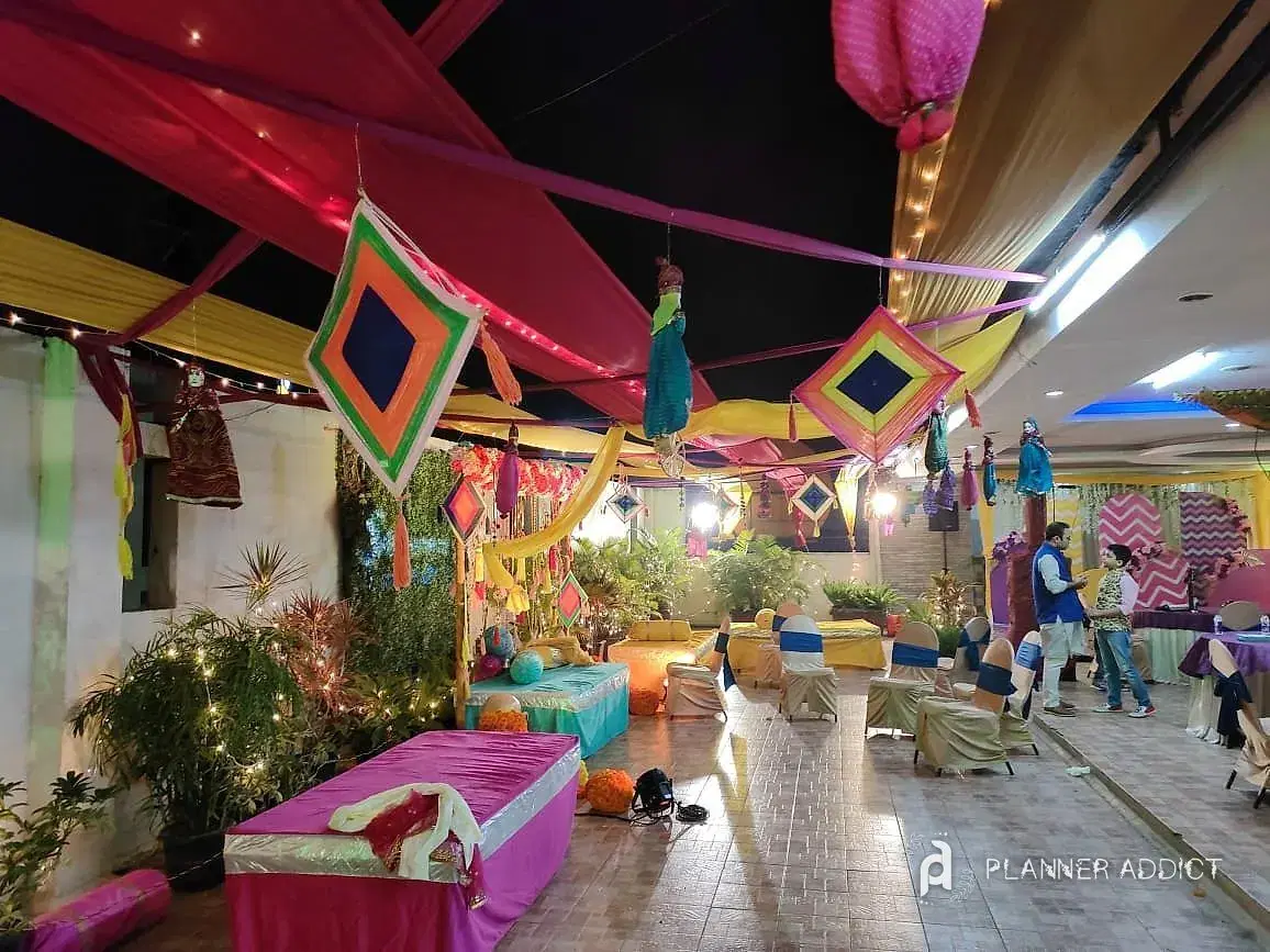 Terrace set-up with hanging kites, coloured canopies and floor seating