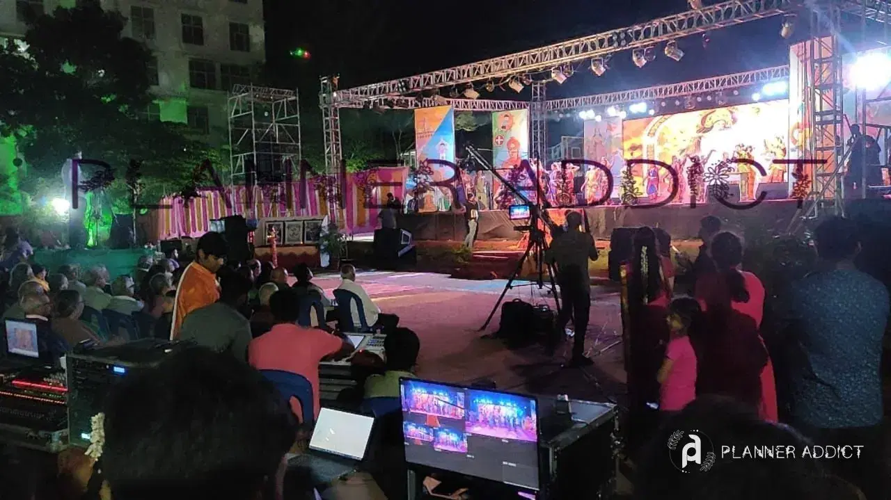 Outdoor stage with lights at an evening event